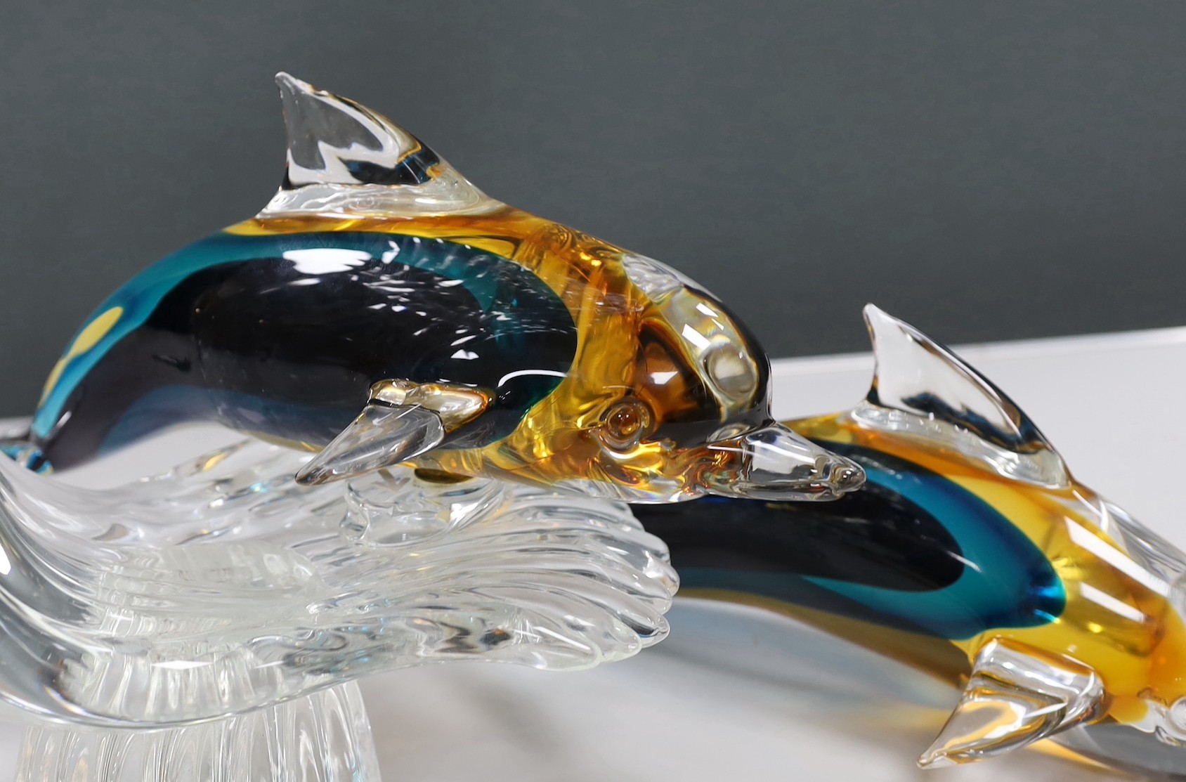 A large Murano Sommerso glass double Dolphin sculpture by Oscar Zanetti, engraved signature and paper label, minor faults to one dolphin, 61cm high